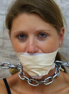 Heavy cuffed and gagged to the wall