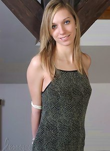 Teen babe in long dress, bound to the pillar